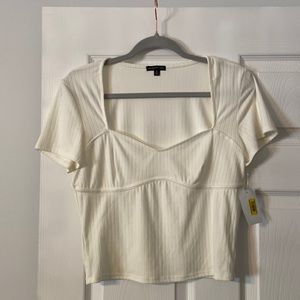 Mmmm Ivory shirt brand new with tags length 19” bust 34”